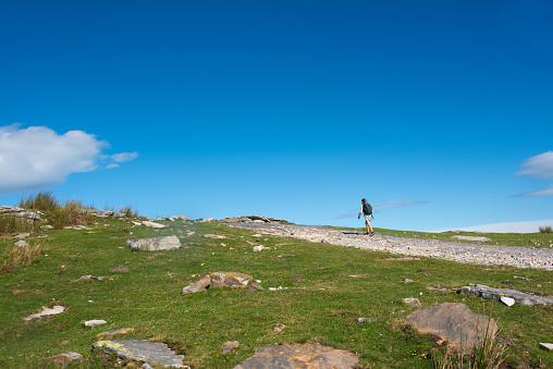 Teenage girl hiking on the mountain of (La Rhune) in the French Basque Country