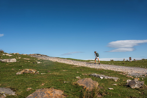 Teenage girl hiking on the mountain of (La Rhune) in the French Basque Country