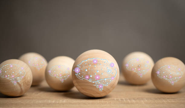 istock AI Brain Concept, an intelligent machine brain that processes by connecting to a network system. A wooden ball with an AI brain is placed on the table. 1697209057