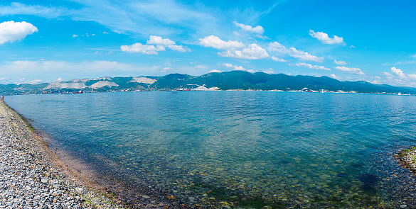 View of the Tsemesskaya Bay of the Black Sea from the Sudzhuk Spit in Novorossiysk, Russia in sunny weather in summer - panorama