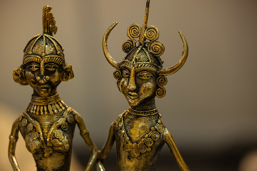 Brass metal art, Handmade sculpture souvenir made with brass with blur background. Selective focus.