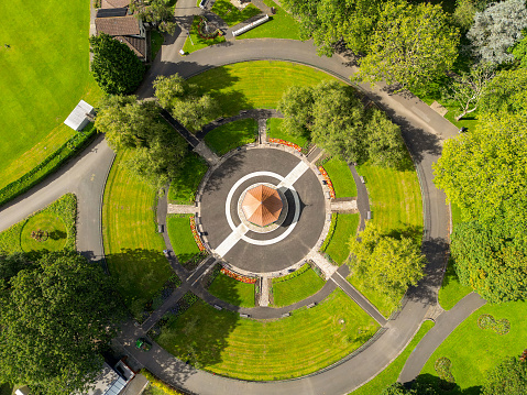 Pontypridd, Wales - 12 September 2023: Drone overhead view of the bandstand and gardens of the town's Ynysangharad park.