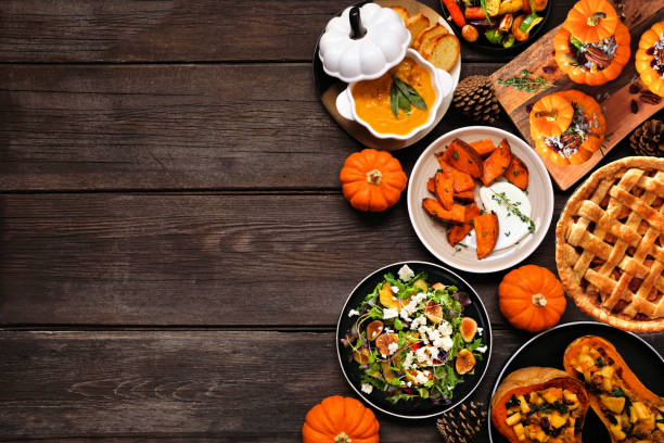 istock Delicious autumn meal side border. Overhead view on a dark wood background. 1697248607