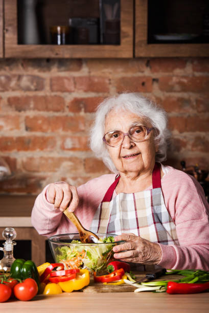 istock Senior woman cooking 1697263249