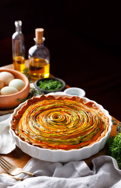 istock Spiral tart in a casserole dish on a table, focus on  inside 1697288772