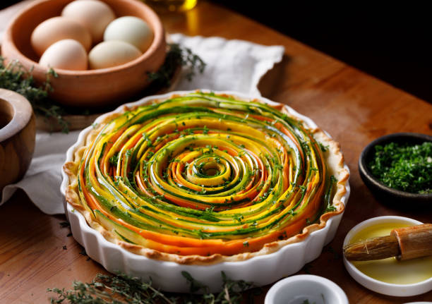 Spiral  tart in a casserole dish on a table, focus on  inside