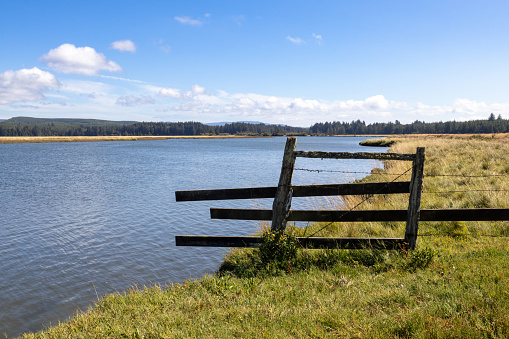A fence along the shore of the Palix River in Washington State