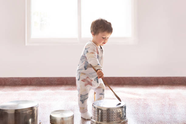 istock 12 month old baby playing drums with pots and pans 1697300652