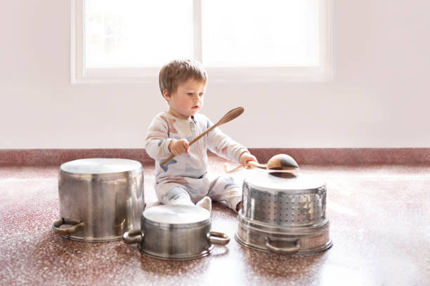 istock 12 month old baby playing drums with pots and pans 1697300653