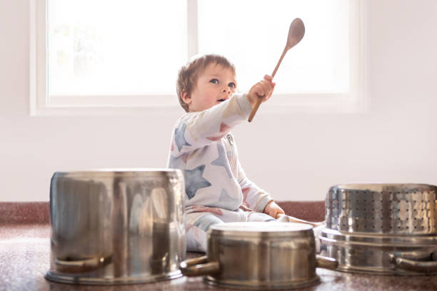 istock 12 month old baby playing drums with pots and pans 1697300796