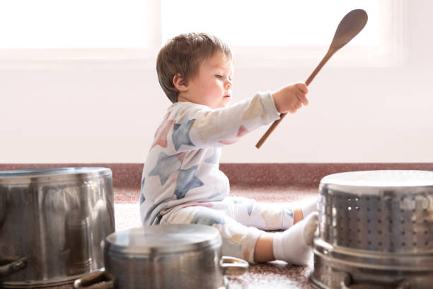 istock 12 month old baby playing drums with pots and pans 1697301168