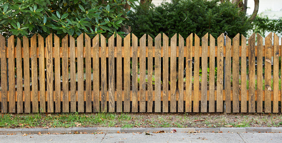 wooden fence, weathered and textured, evoking nostalgia and rural charm, against a soft-focus background, ideal for conveying authenticity and homely warmth