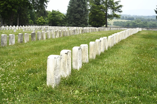 Lines of gravestones mark the resting places of fallen combatants  from battle at Antietam National Battlefield cemetery.