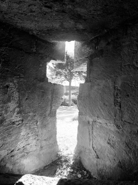 istock Peaking from a Cross in black and white 1697329496