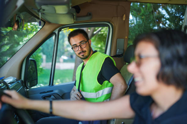 istock Female driver and employee in vehicle 1697351935