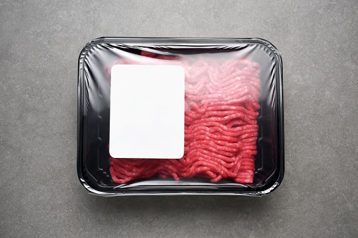 Ground beef, table top view minced meat package with blank label (Label has Clipping Path)