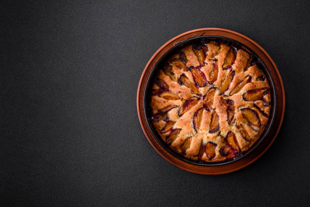 Delicious sweet aromatic homemade pie with ripe plums
