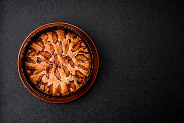 Delicious sweet aromatic homemade pie with ripe plums