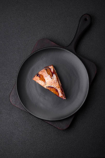 Delicious sweet aromatic homemade pie with ripe plums
