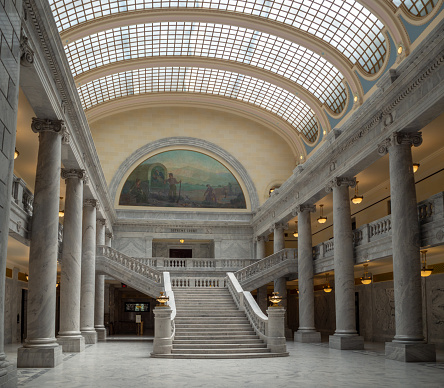 State of Utah Capitol hill complex in Salt Lake City, historic exterior and rotunda dome interior with house, senate and soupreme court chamber, staircase, and paintings, tourist visitors