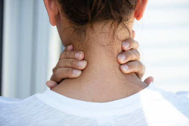 istock Woman With Neck Pain 1697440636