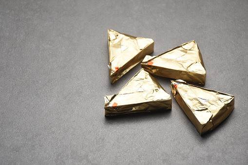 Gold colored packaged triangle shape cheese
