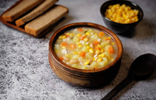 istock Fresh hot corn white bean potato soup in a bowl 1697472199