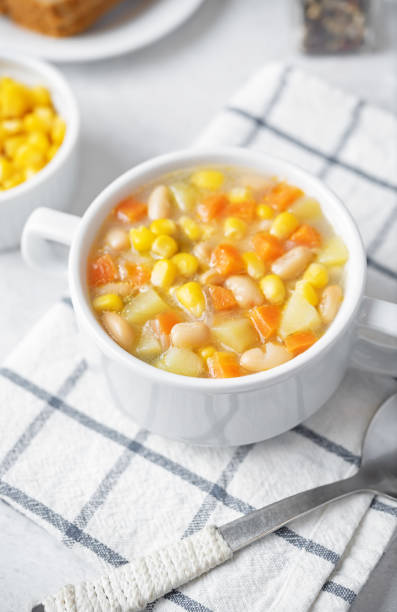 istock Fresh hot corn white bean potato soup in a bowl 1697472219