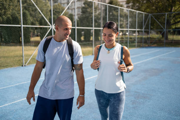 istock Young couple arriving to a outdoor workout 1697521770