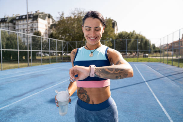 istock Young sportswoman checking pulse on smartwatch during outdoor exercise 1697522310