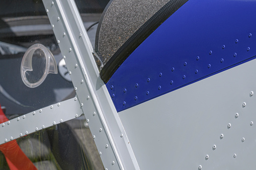 Rivets, texture, surface - side of a blue light aircraft.