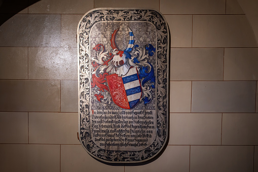 Baden-Wurttemberg, Germany - Dec 14, 2019: Memorial Plaque with Coat of Arms at St. Michael Chapel - Catholic Chapel at Hohenzollern Castle - Germany