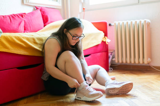 istock Young woman with Down Syndrome exercise 1697581151