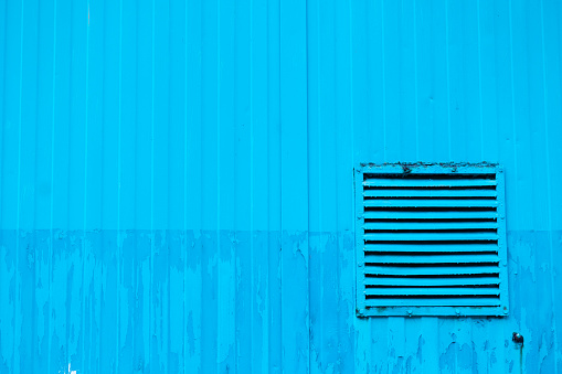 Blue Wall with a ventilation grill. Krakow.