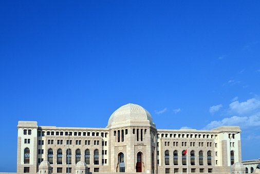 Muscat, Oman: Supreme Court of Oman - the domed, stone clad building comprises offices for the judges, the Court secretariat and the Public Prosecution - Islamic architecture with modernist influence - Al-Ghubra district.
