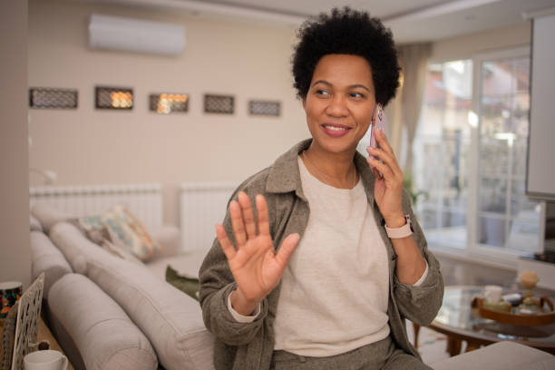 istock Happy mature woman using phone 1697803388
