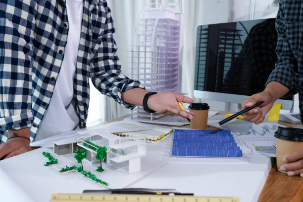 Asian Architect Students Studying Modern House Design and Finding Ways to Utilize Natural Alternative Energy or Use Natural Renewable Energy, Concepts of Eco-Friendly Living for a Sustainable Future.