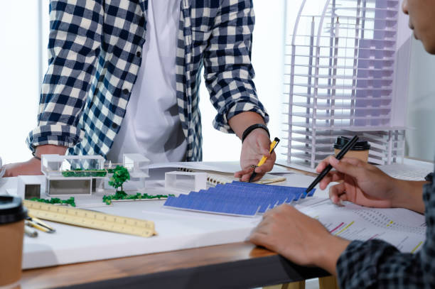 istock Asian Architect Students Studying Modern House Design and Finding Ways to Utilize Natural Alternative Energy or Use Natural Renewable Energy, Concepts of Eco-Friendly Living for a Sustainable Future. 1697805193