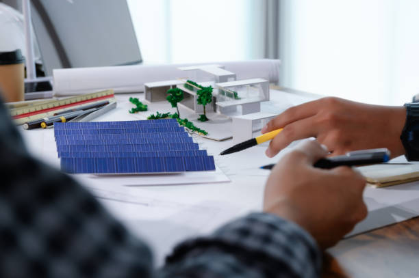 istock Asian Architect Students Studying Modern House Design and Finding Ways to Utilize Natural Alternative Energy or Use Natural Renewable Energy, Concepts of Eco-Friendly Living for a Sustainable Future. 1697805199