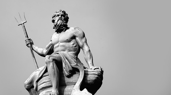 Mighty and powerful god of the sea, oceans and water Neptune (Poseidon). Black and white image. Copy space.