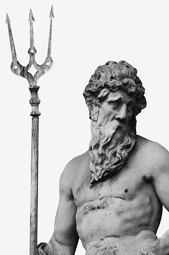 The mighty god of sea and oceans Neptune (Poseidon). Fragment of an ancient statue. Black and white vertical image.