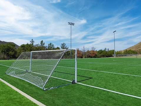 A rear angle view of soccer goal looking down field