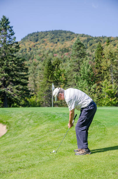 istock Amateur golfer swinging ball 1697968845