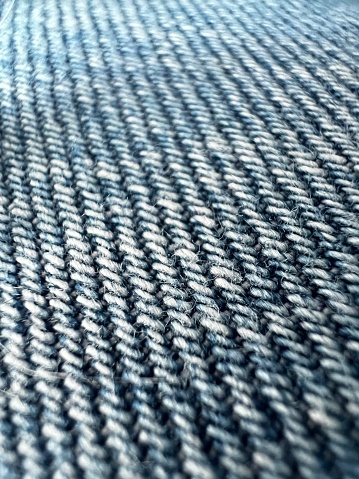 A macro photography of denim fabric