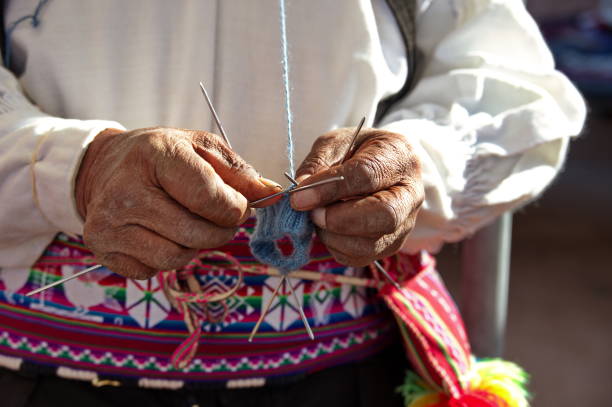 istock Closeup of old man hands knitting 1698124191