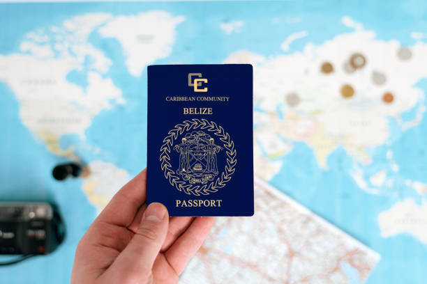 istock belize passport holding in hand 1698182239