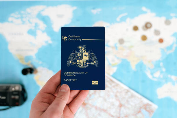 istock dominica passport holding in hand 1698182767