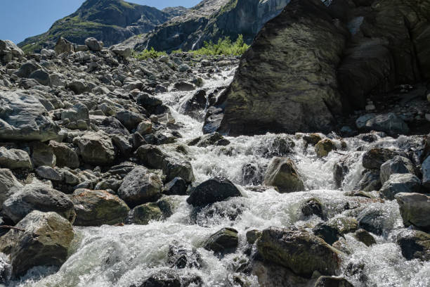 istock A fast water flow of a mountain river runs through a mountain valley 1698212003