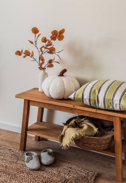 istock Scandinavian style interior - oak bench with autumn decor, pillow in the hallway in rustic style 1698212257