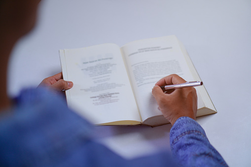 Author or Writer Signing the Book on the Table, Book Signing Event Concept